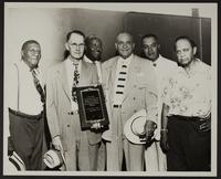 Tom Baird with Dr. J.B. Martin and others receiving the National Baseball Congress plaque, 2 copies
