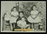 Mrs. Thomas and children at Christmastime