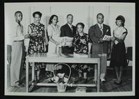 Sororities - Delta Sigma Theta - Group of seven standing holding issue of Negro Heroes (No. 2, Summer Issue) behind table holding more copie