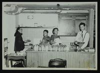 Girl Scouts preparing dinner for fathers