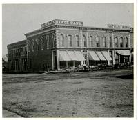 State Bank, Nathan Frank Groceries, and Theo. Pohler Groceries - Southeast Corner of 9th & Massachusetts St.