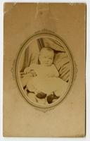 Portrait of a baby framed by an oval mat