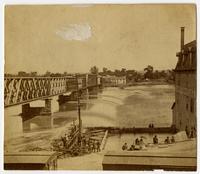 Close-up of bridge across Kaw River at flood stage, Douglas County Mills at right (1876 Flood)