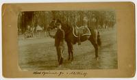 General W. S. Metcalf with Black Squirrel, Jr. [horse] on Massachusetts Street