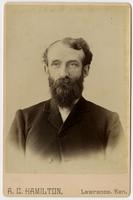 Portrait of a man with dark full facial hair