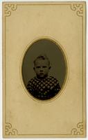 Portrait of small boy with crosshatch shirt, framed by mat