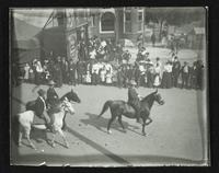 Parade of three people on horses (Semi-Centennial Parade)