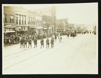 Police, two Native Americans, buffalo from University of Kansas [KU] museum, and KU band (75th Anniversary Historic Parade)