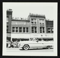 People watching from top of buildings (Lawrence Centennial Parade)