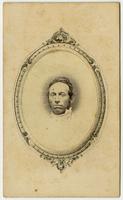 Portrait, small image of a man centered in a decorative oval frame