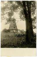 Windmill - Front view with tree and stone fence in foreground