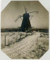 Windmill - Front view in snow showing house and valley