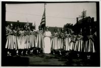 Group of women wearing and carrying flags