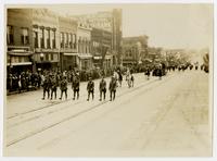 Police, two Native Americans, buffalo from University of Kansas [KU] museum, and KU band