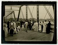 People on Massachusetts Street bridge