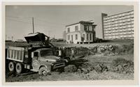 W. Z. Dunbar and Son, construction workers digging foundation for University of Kansas dorms on Iowa Street, house being moved