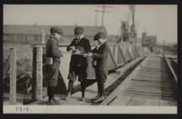 Views at railroad bridge and water treating plant; Junior and Cooky; views of new cement viaduct arch