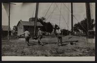 Workmen putting up steel water tank at Altoona, Kansas