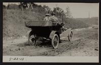 Charles Browne and Willard Phiffer in auto; pictures taken for Paving Commission, hauling asphalt