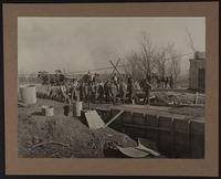 Concrete gang working on septic tank