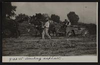 Charles Browne and Willard Phiffer in auto; pictures taken for Paving Commission, hauling asphalt