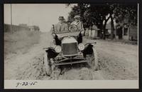 Charles Browne and Willard Phiffer in auto; pictures taken for Paving Commission, hauling asphalt