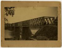 Wooden Bridge with Men Over Kaw River
