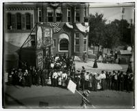 Crowd in front of prop buildings (Semi-Centennial Parade)