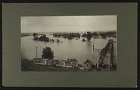 Looking north over river with people at bridge (1903 Flood)