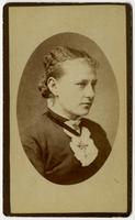 Portrait of woman with black ribbon cross necklace