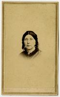 Portrait, small image of woman with glasses, dark hair and lacy headpiece
