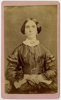 Portrait of woman with short hair, earrings, and frilled white collars