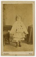 Photo of child with boots, hat, and muff