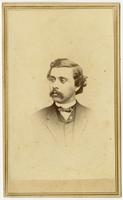Small portrait of a man with dark curled hair and a mustache