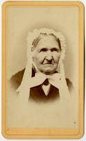 Portrait of old woman with lacy cap and white bow