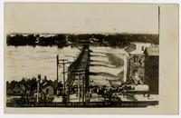 Crowd looking north over dam at Bowersock Mill (1908 Flood)