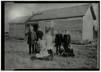 Unidentified Family in Front of Homestead