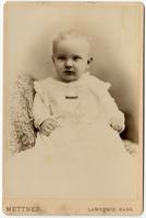 Portrait of a baby in a white dress