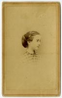 Portrait of a girl with a gingham top and bun