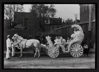 Children in carriage decorated for parade