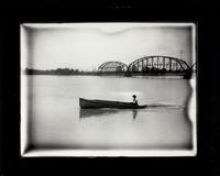 Bridge and man in boat
