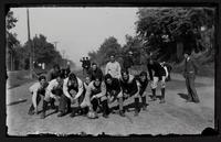 Football team in street, 1895