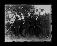 Group near stone wall