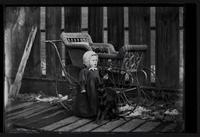 Baby near baby carriage