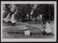 Girls on seesaw