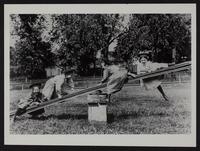 Girls on seesaw