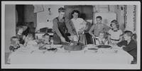 Fires - Mr. and Mrs. Calla McAlexander in new home built by friends and fellow workers. Near Oskaloosa. (L to R) Kathie; Vickie; Dennis; Johnny; David; Cleo; Diane; Judy; Calvin.