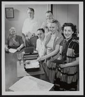 Lawrence Board of Education - Office in Junior High Building (L to R) Mrs. Leon Abel; William D Wolfe, Supt. Richard Johnson, supervisor. of buildings; Armin E. Woestermeyer, Clerk of the Board; Miss Vesta White, Sec. to Wolfe; Mrs. Leona Flanders, Bookkeeper.