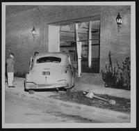 Auto wrecks - Damage to front door of Journal World building - Lawrence B. Brouhard, Eudora.