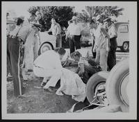 Auto Accidents - Peggy Shane of Topeka is lifted onto stretcher.